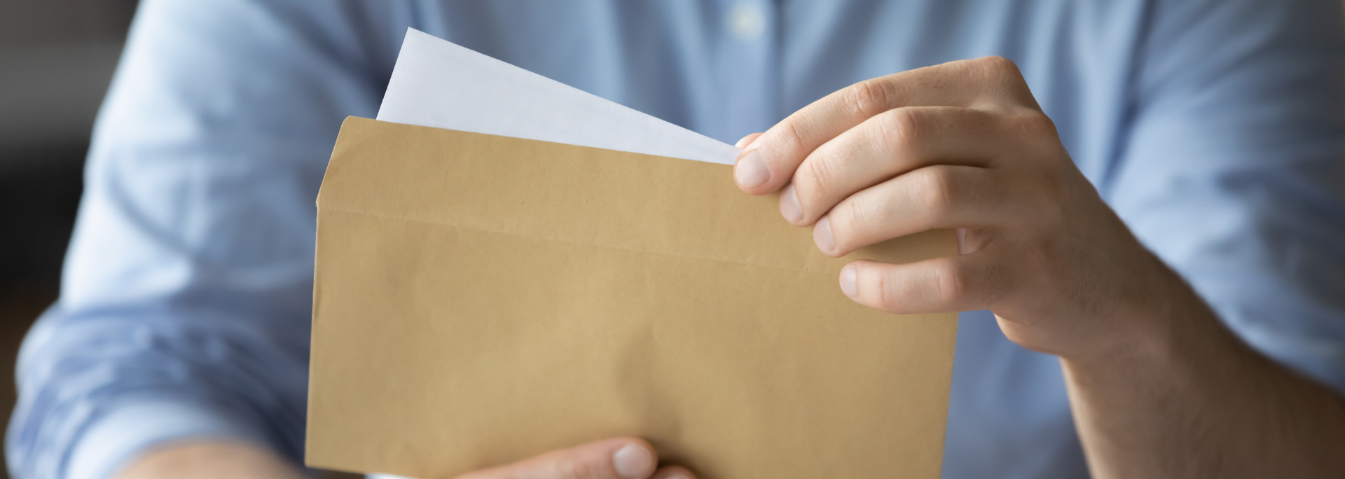 Picture of a person opening a letter. Picture of a person opening a letter.