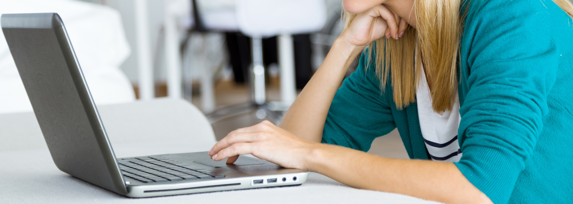 Picture of someone using a laptop. 