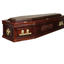 A wooden coffin with gold handles on a white background