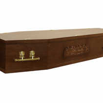 A wooden coffin with gold handles on a white background