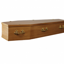 A wooden coffin with gold handles on a white background