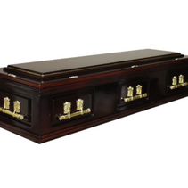 A wooden coffin with gold handles on a white background