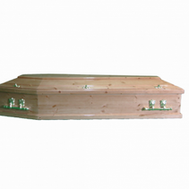 A wooden coffin is sitting on a white surface.