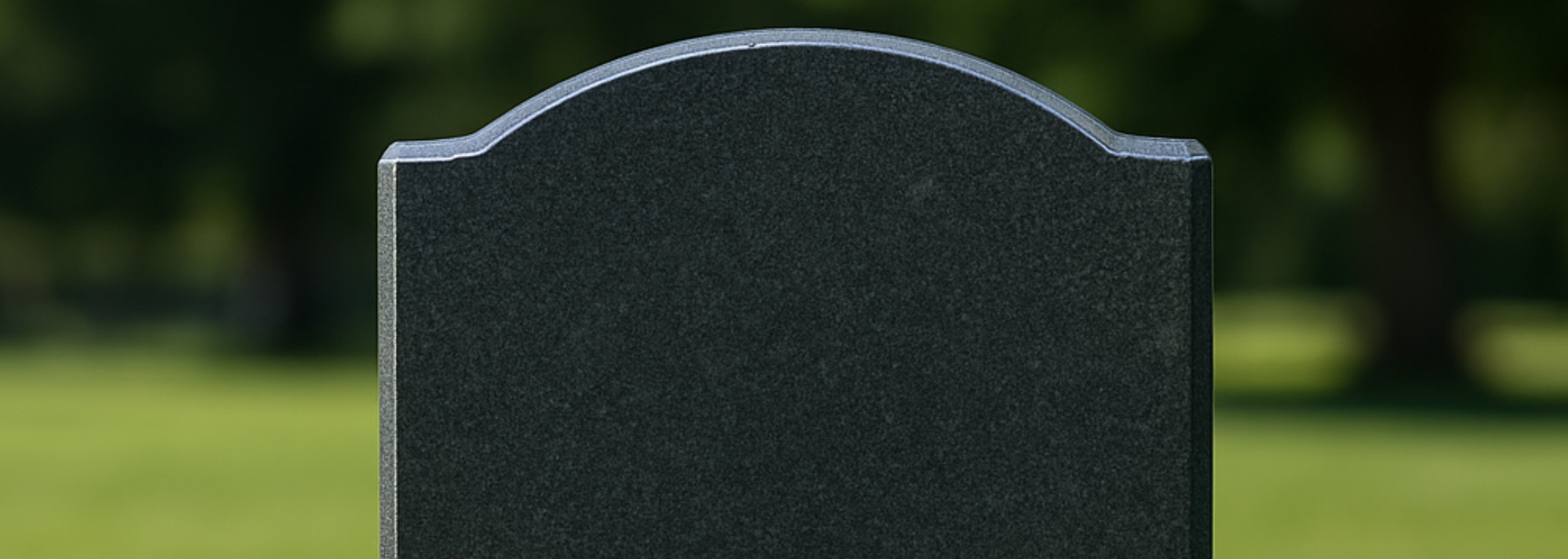 Alt text Picture of headstone in a cemetery. Picture of headstone in a cemetery.