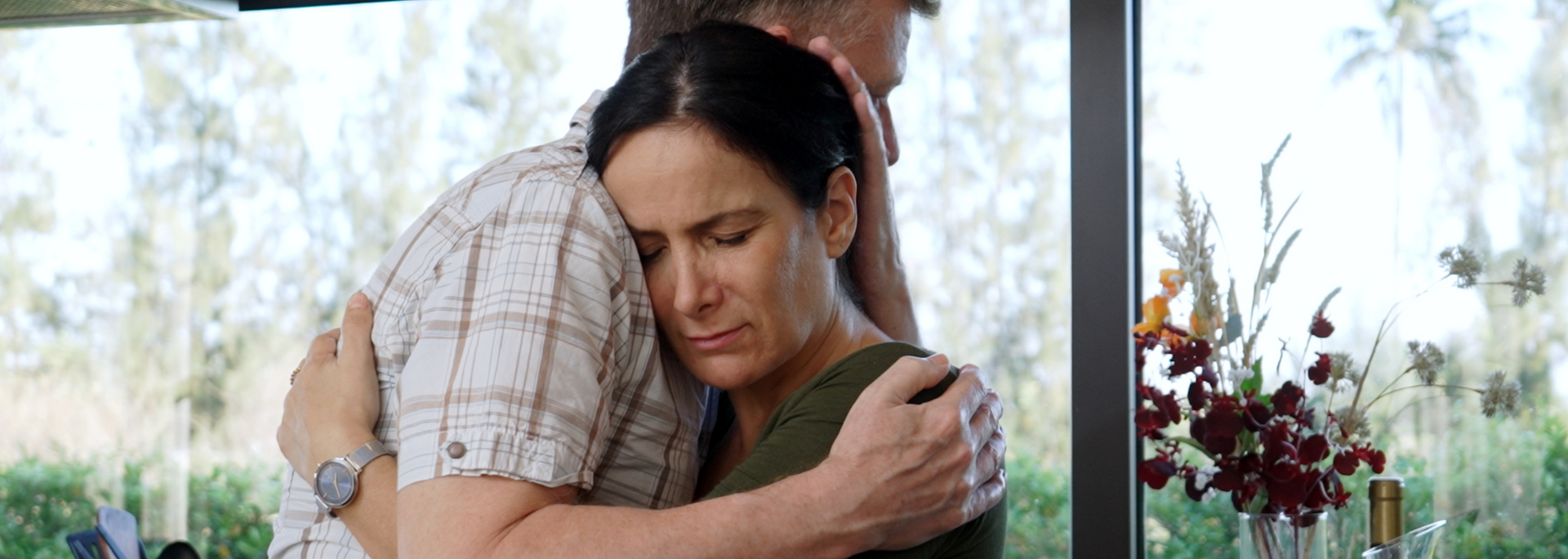 Picture of two parents consoling one another. Picture of two parents consoling one another.