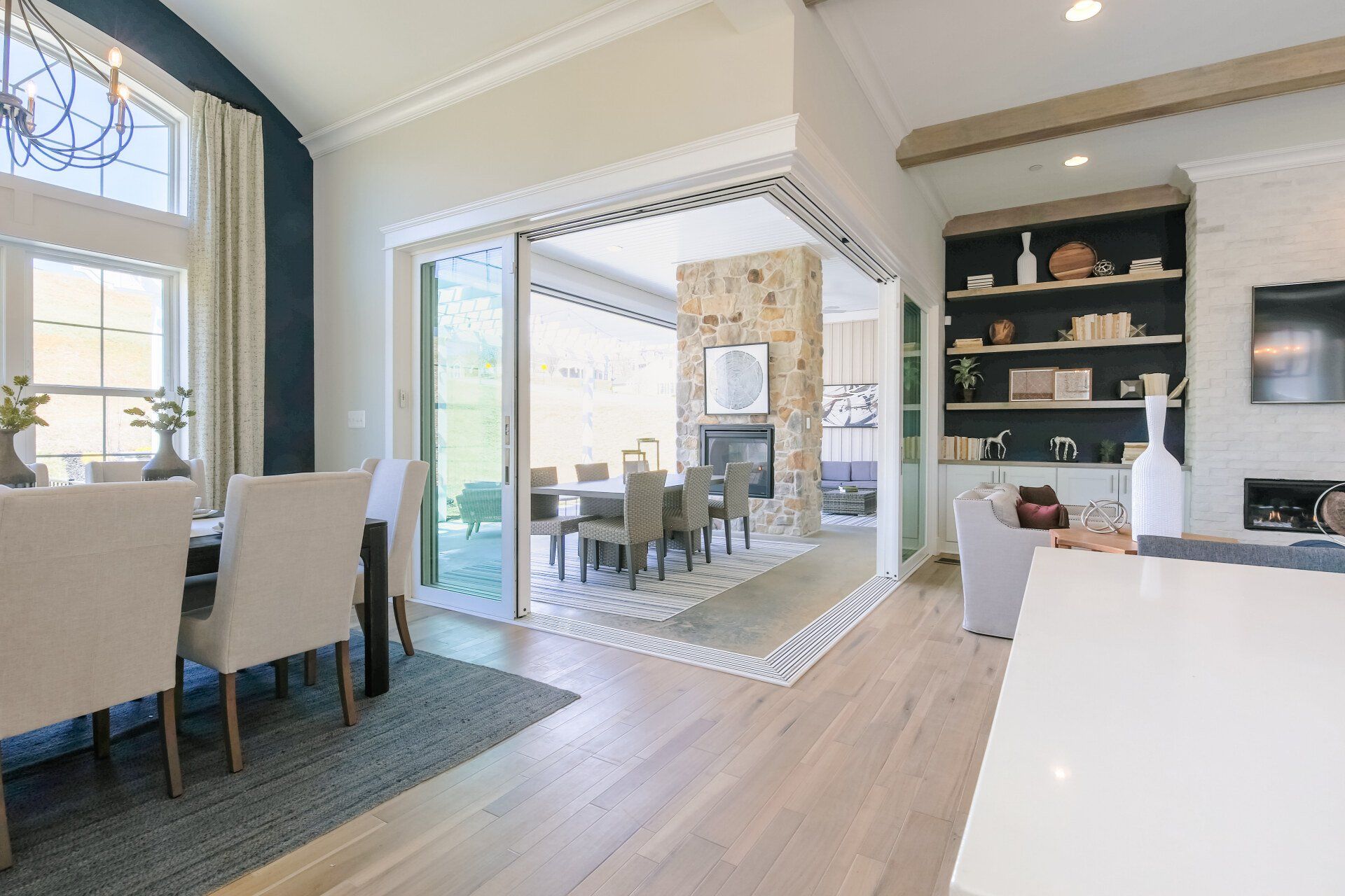 Spacious dining room with sliding glass doors leading to outdoor dining area.