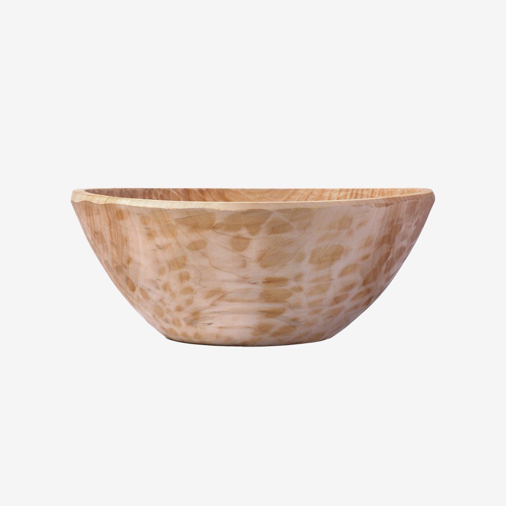 Small light wood bowl with a natural grain pattern on a white background