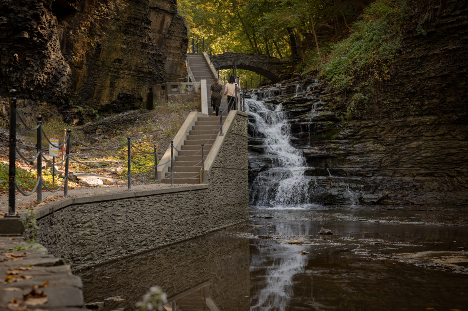 An aerial view of a city and a lake at sunset.