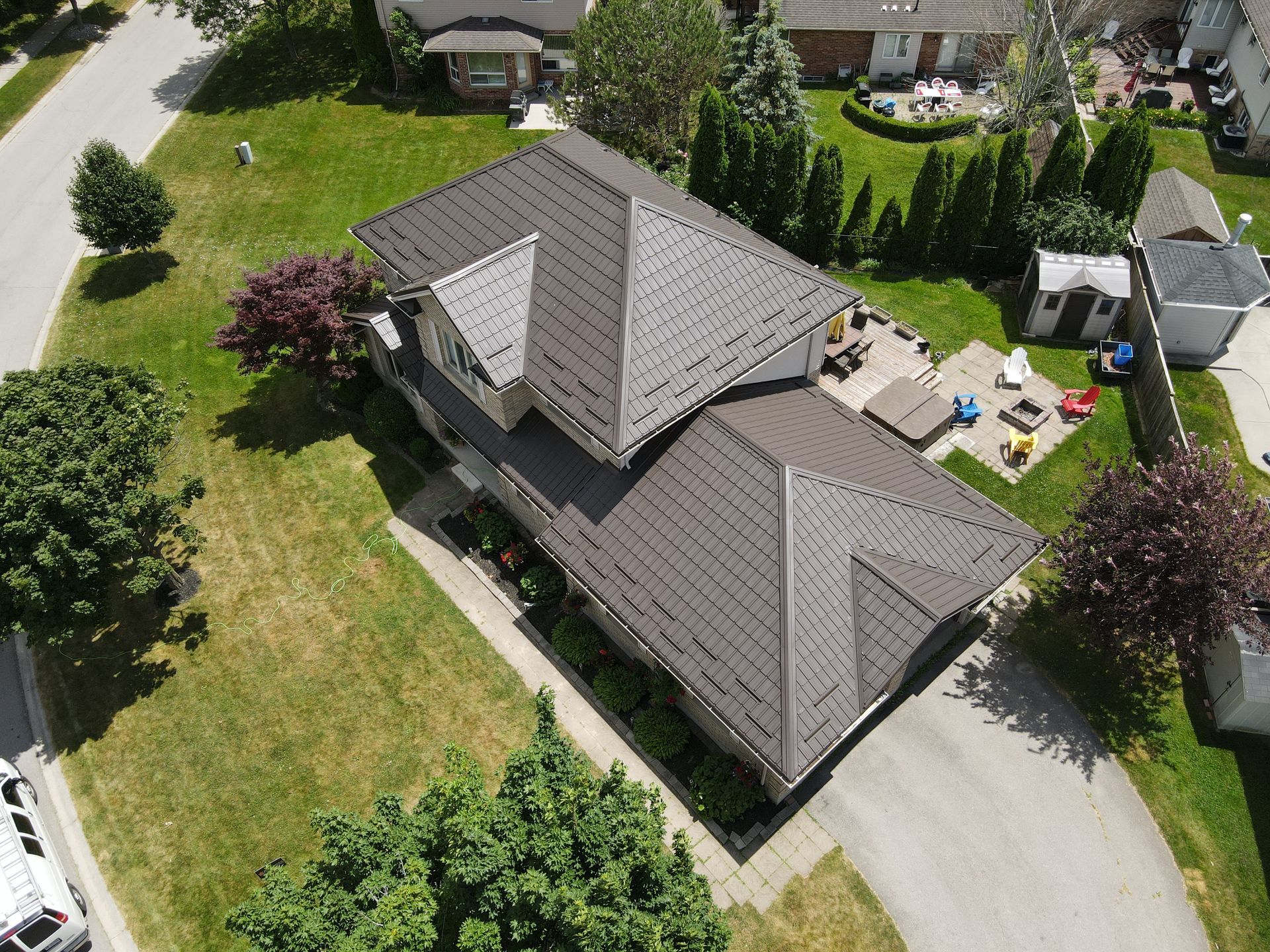 An aerial view of a house in a residential area