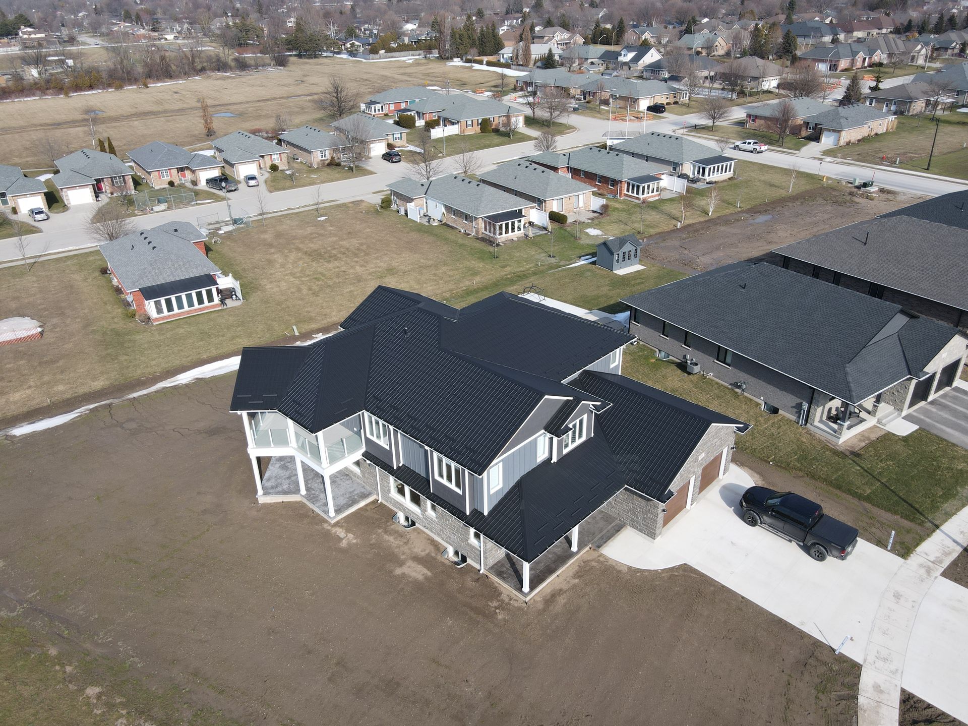 An aerial view of a house in a residential area