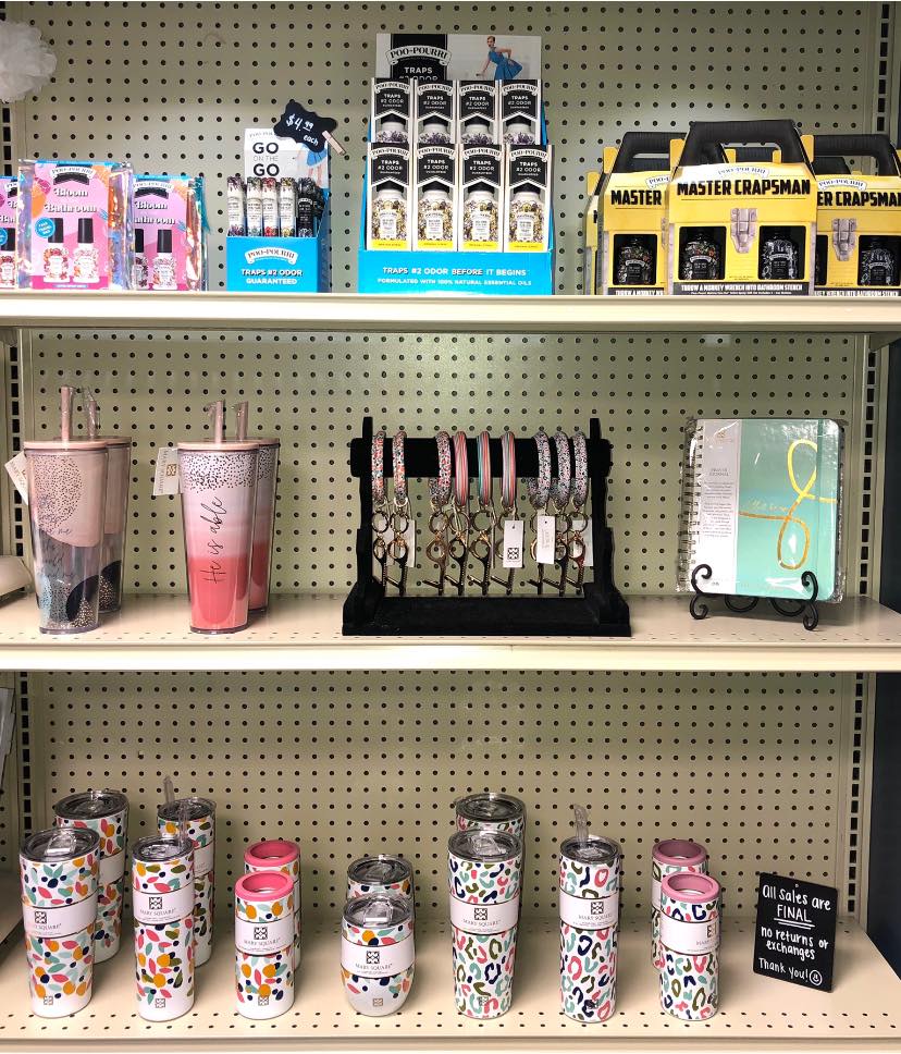display of tumblers, glasses, mugs on store shelves