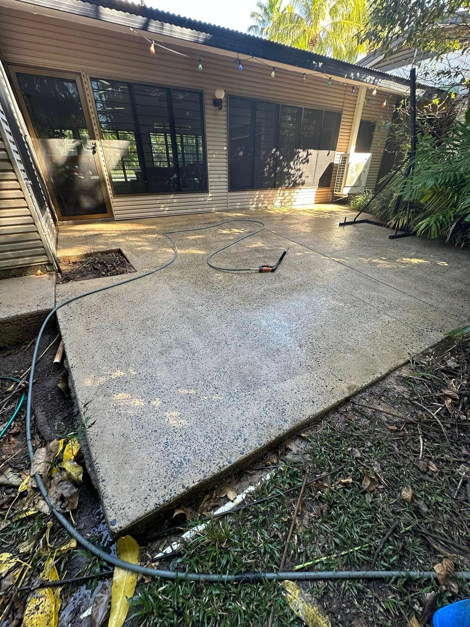 Backyard Concrete Patio Beside A House — I Do It All in Caloundra, QLD