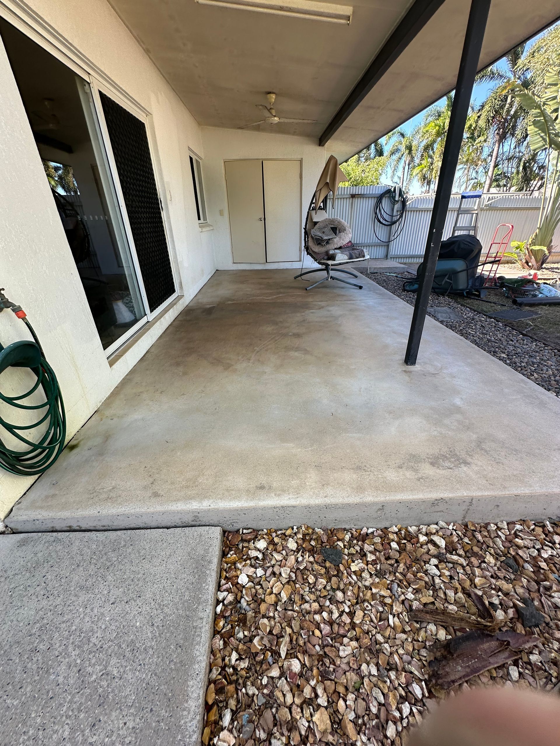 Covered Concrete Patio With a Black Support Post — I Do It All in Caloundra, QLD