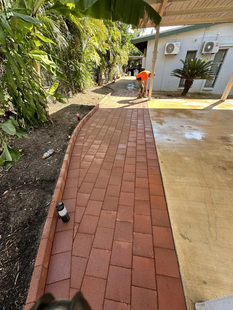 Brick Walkway Beside a Beige House, With Lush Greenery — I Do It All in Caloundra, QLD