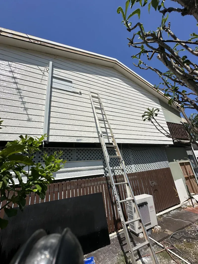 A Ladder Leaning Against a House with White Siding — I Do It All in Caloundra, QLD