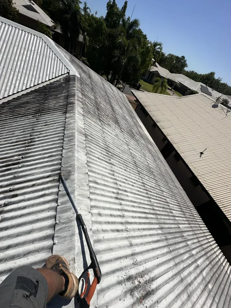 Person Power Washing a Dirty Corrugated Metal Roof — I Do It All in Maleny, QLD