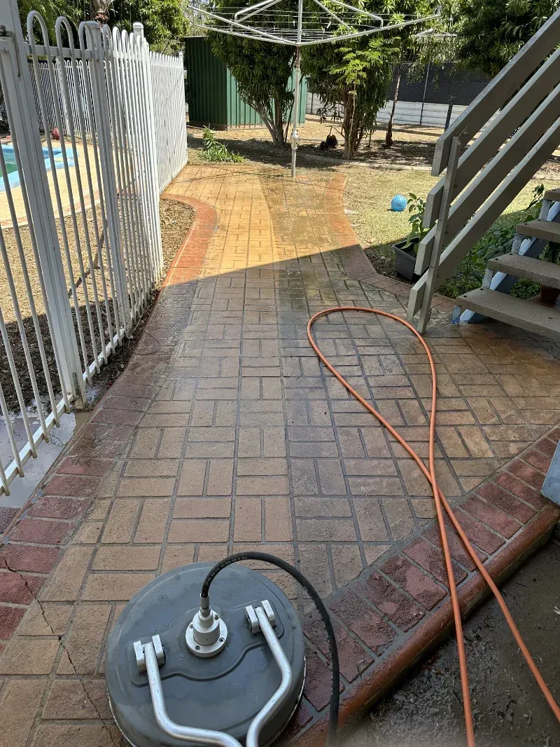 Circular Surface Cleaner on a Wet, Patterned Brick Patio — I Do It All in Caloundra, QLD