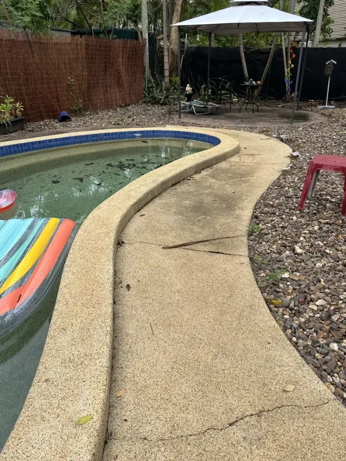 Curved Concrete Pool Deck Beside a Small Backyard Pool — I Do It All in Caloundra, QLD