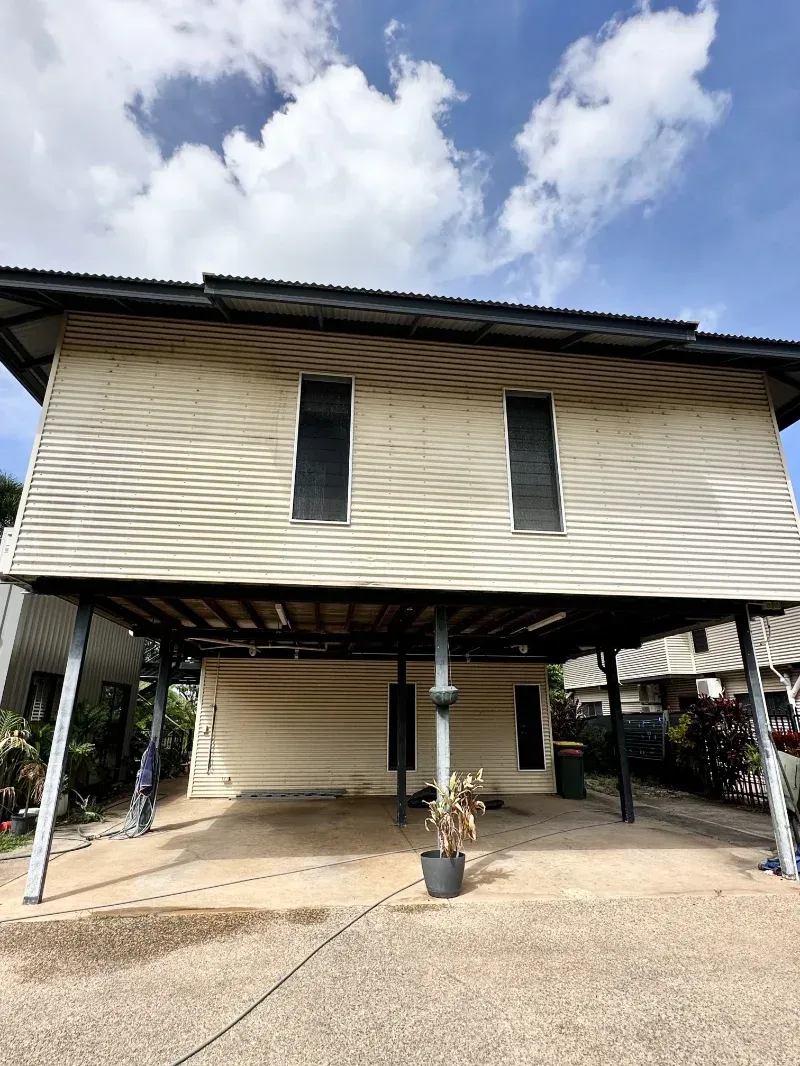 Light-coloured House Elevated on Metal Stilts — I Do It All in Caloundra, QLD