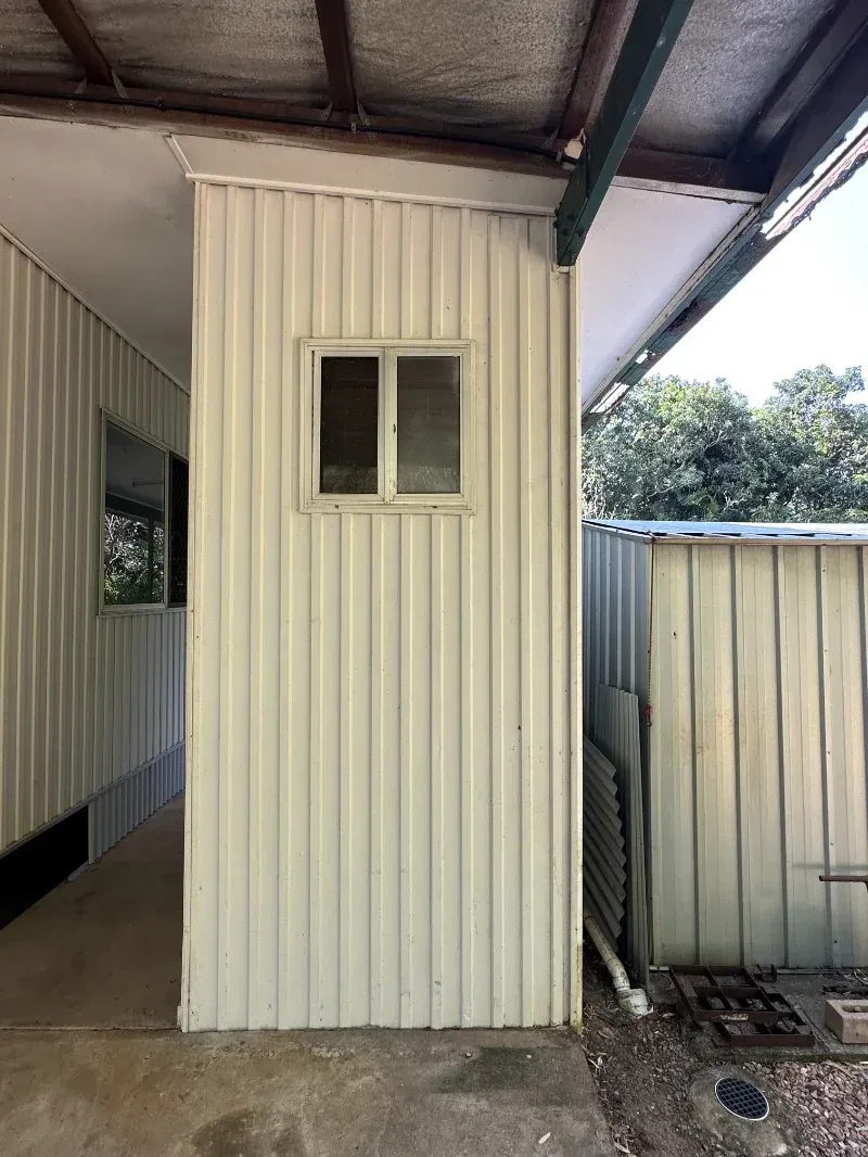 Small Beige Corrugated Metal Building with A Window — I Do It All in Caloundra, QLD