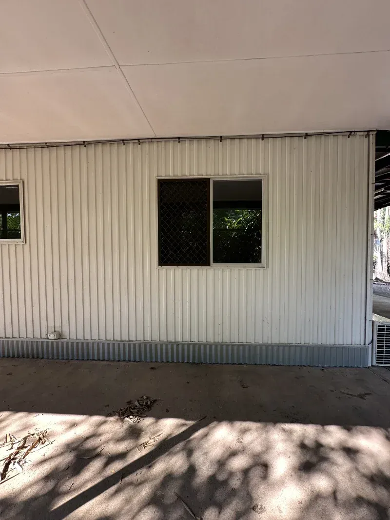White Corrugated Building Wall with Two Windows— I Do It All in Caloundra, QLD