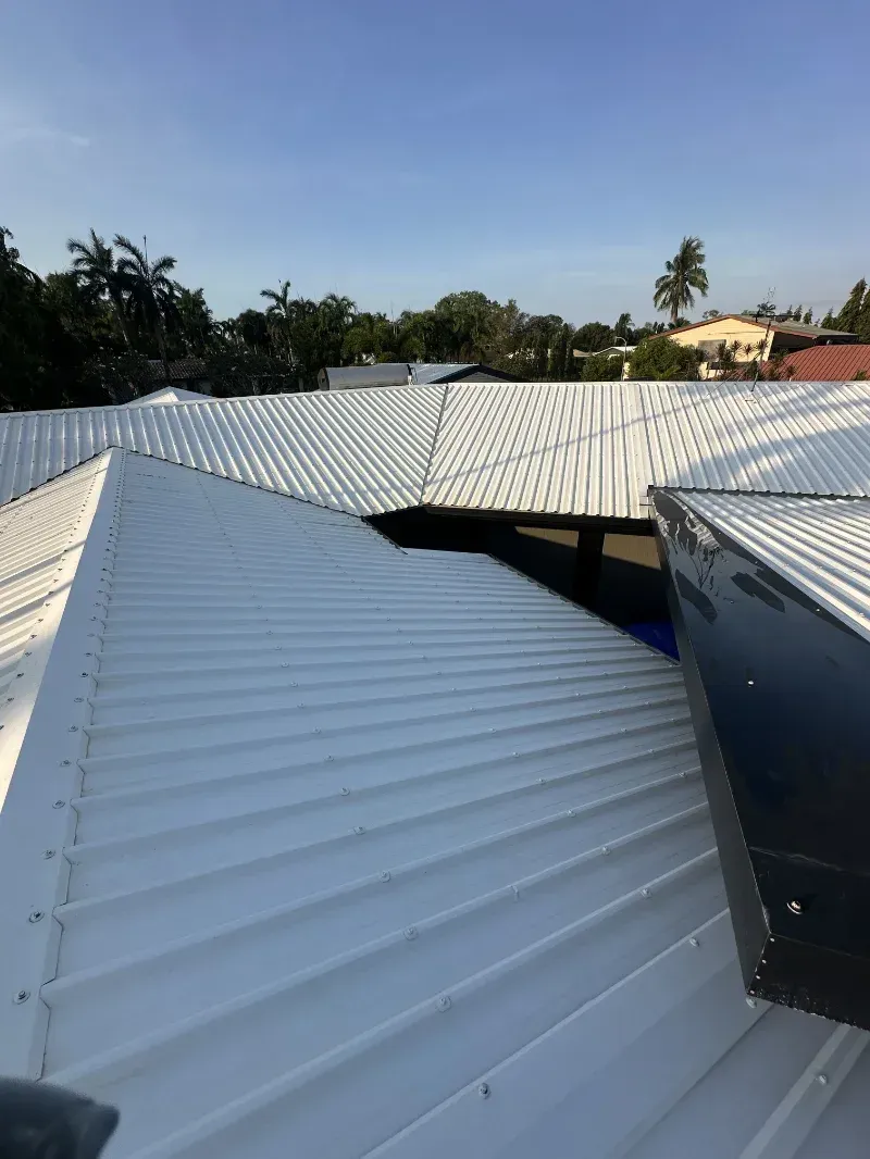 A White Corrugated Metal Rooftops — I Do It All in Caloundra, QLD