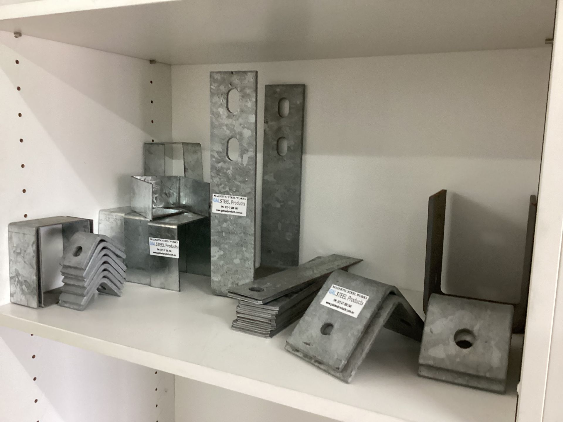 Man Welds a Fence Panel — Angle Processing Townsville, QLD