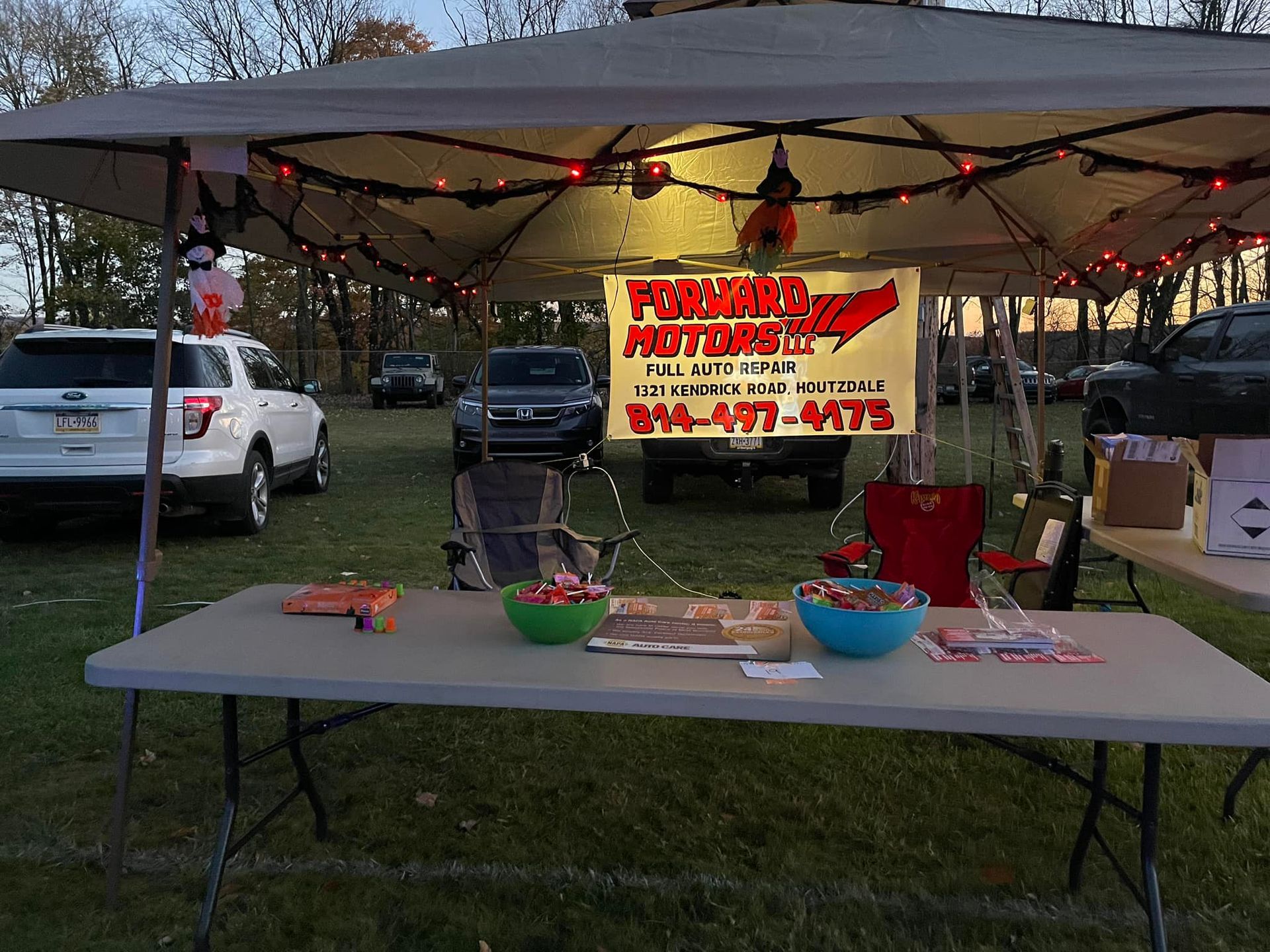 Forward Motors| Cars are parked nearby.