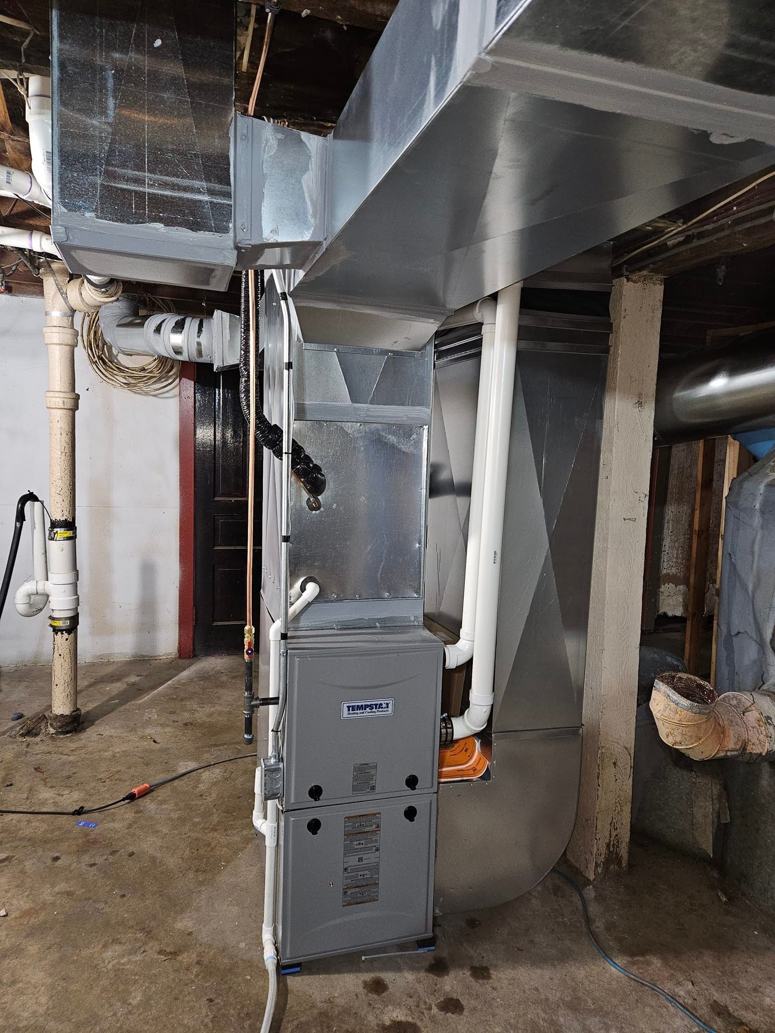 There is a furnace in the basement of a house.