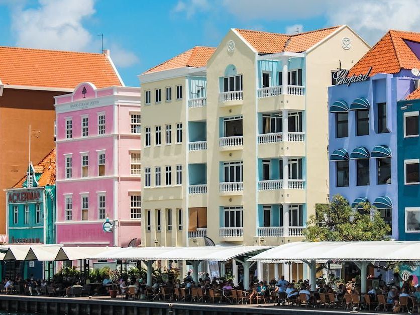 A row of colorful buildings on a sunny day