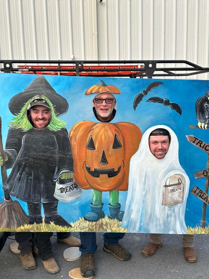 Three men in halloween costumes are posing for a picture.
