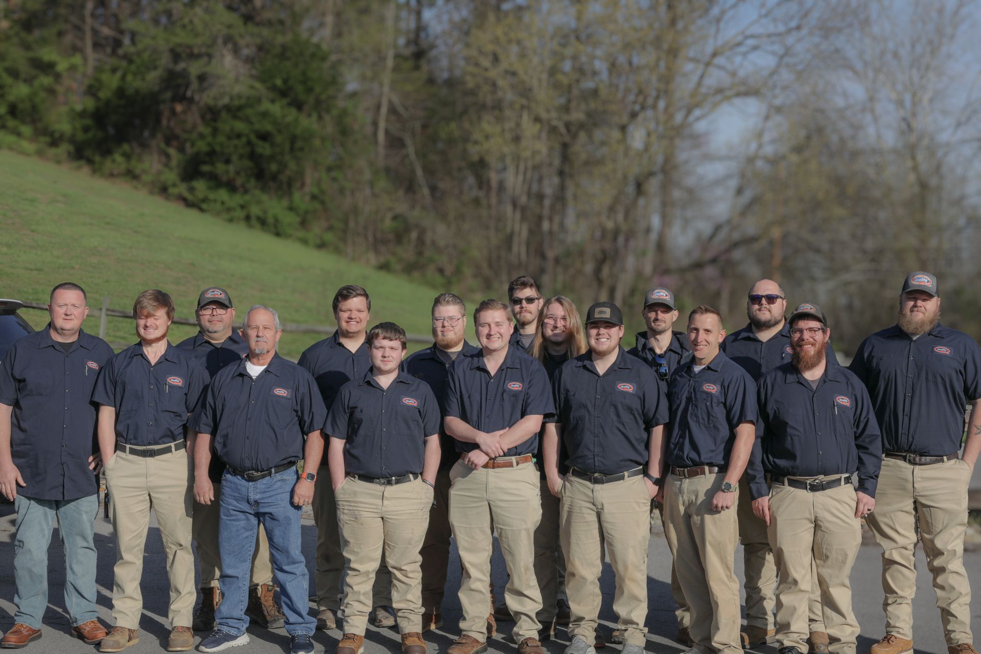 A kitchen with a washer and dryer and a microwave.