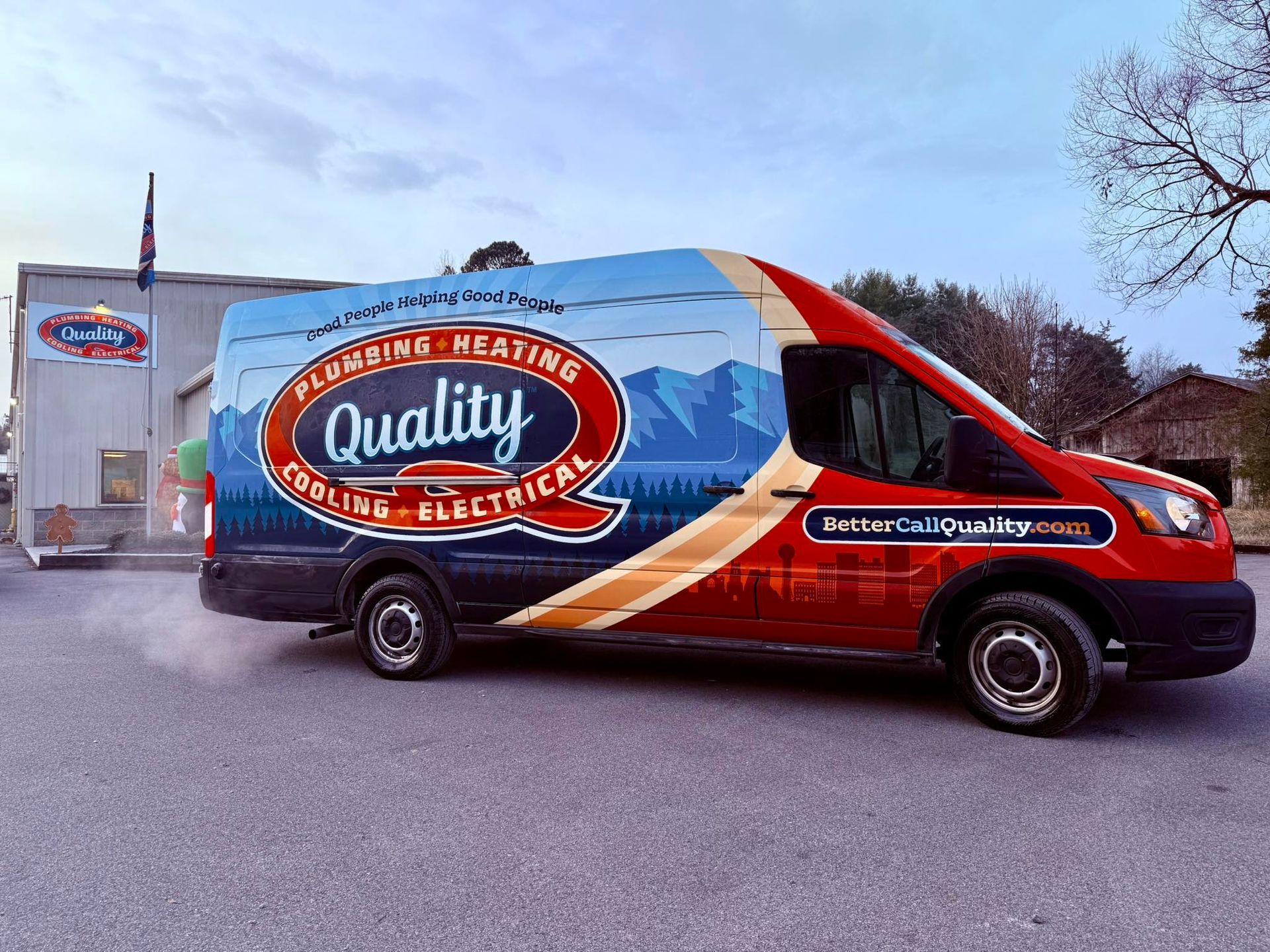 Quality Plumbing Heating Cooling Electrical van parked outside a building, colorful logo.