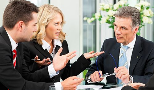 Professional with the client discussing about the business