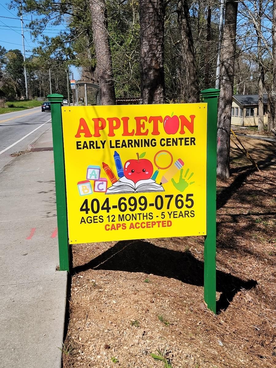 A yellow and green sign for appleton early learning center