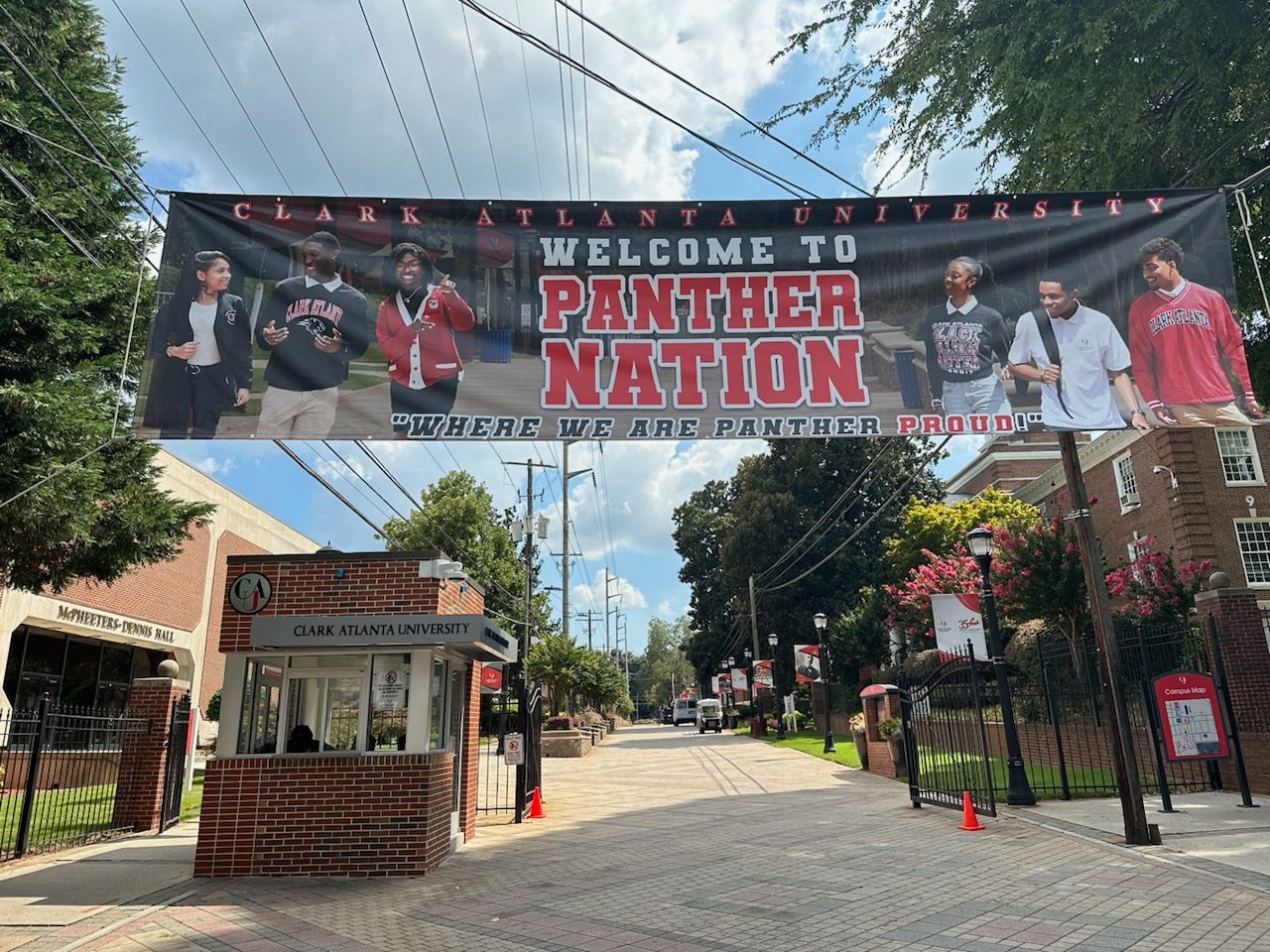 A welcome to panther nation banner hangs over a street
