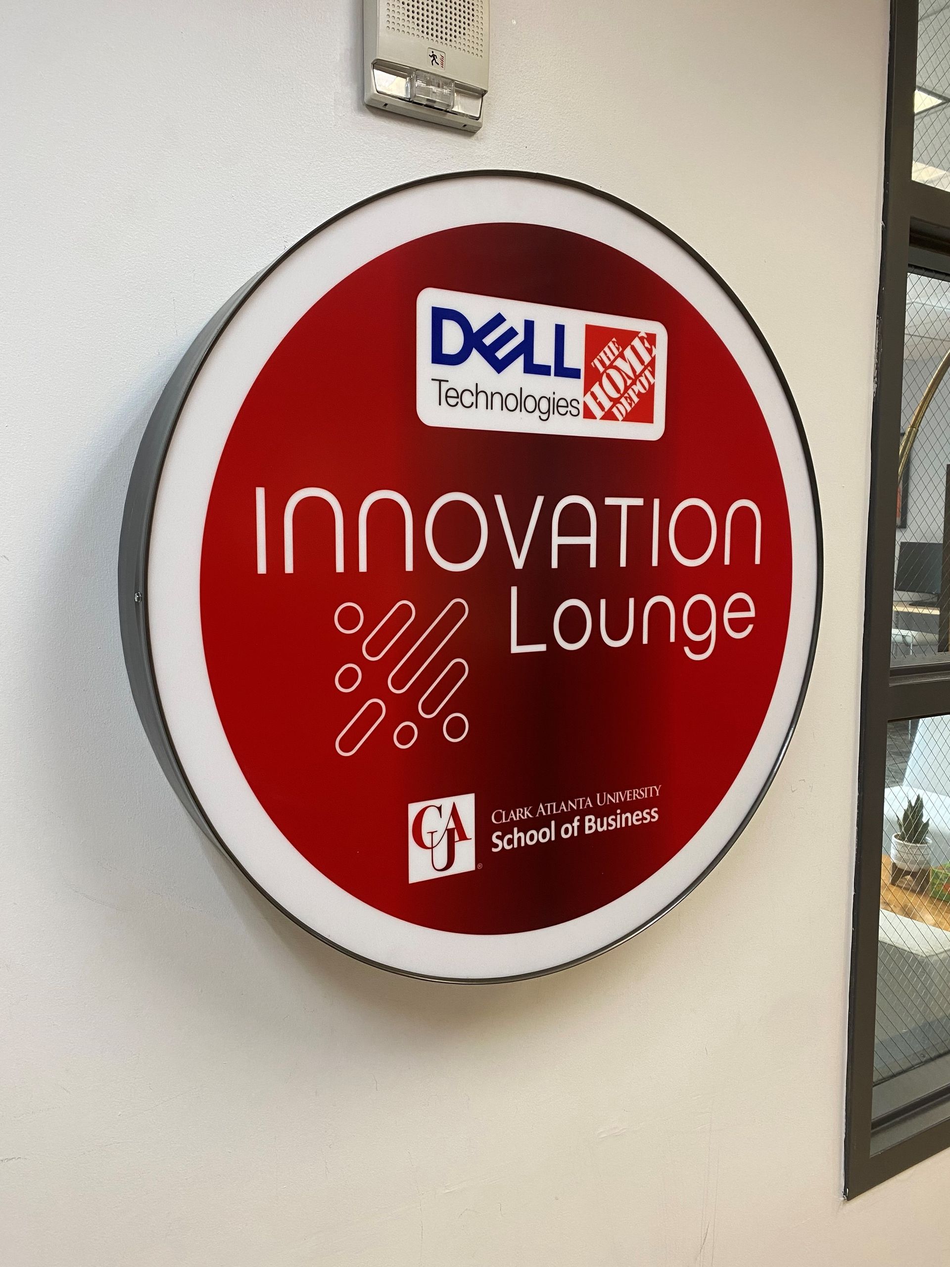 A sign that says innovation lounge on it