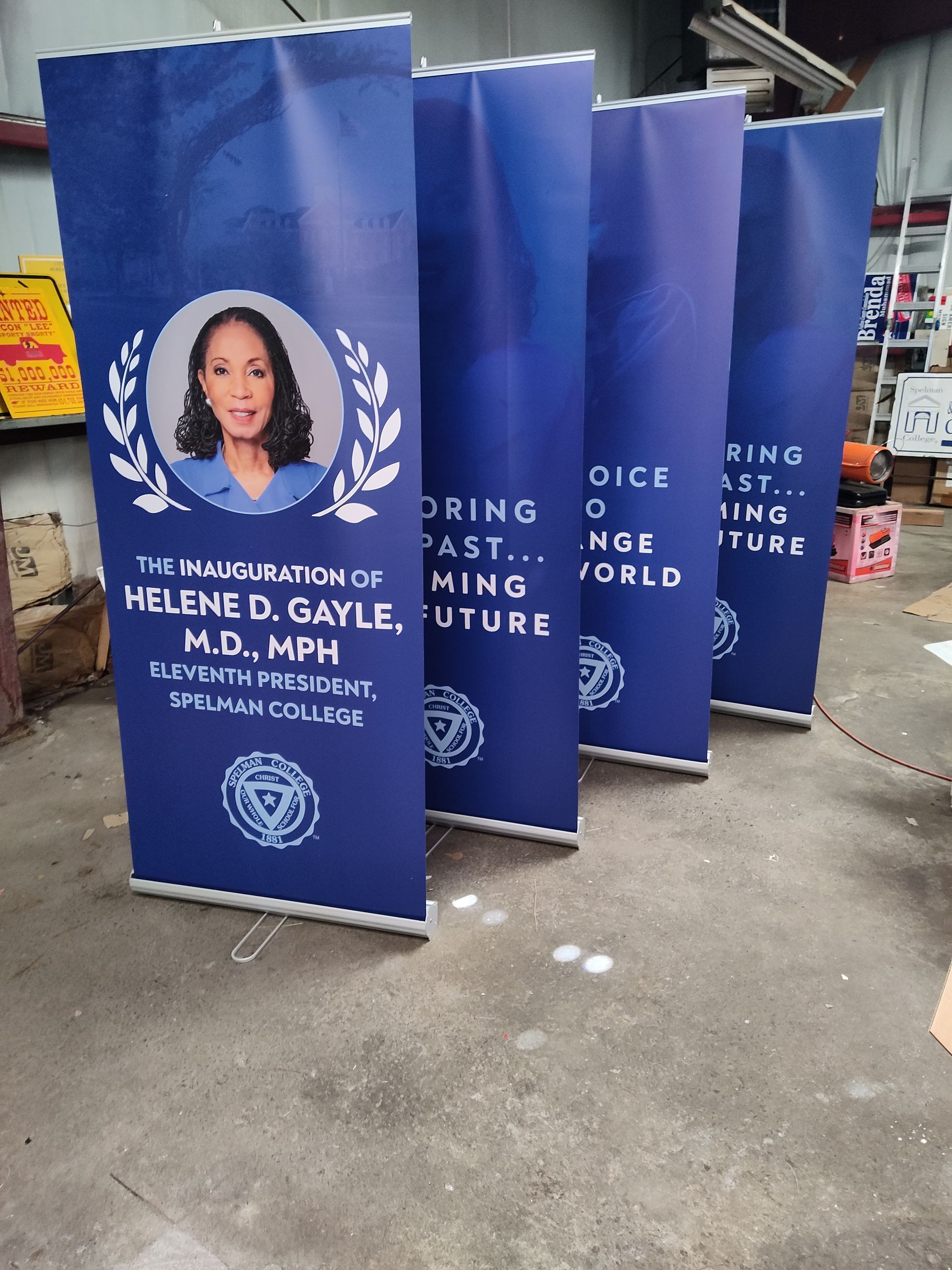 A group of blue banners with a picture of a woman on them.