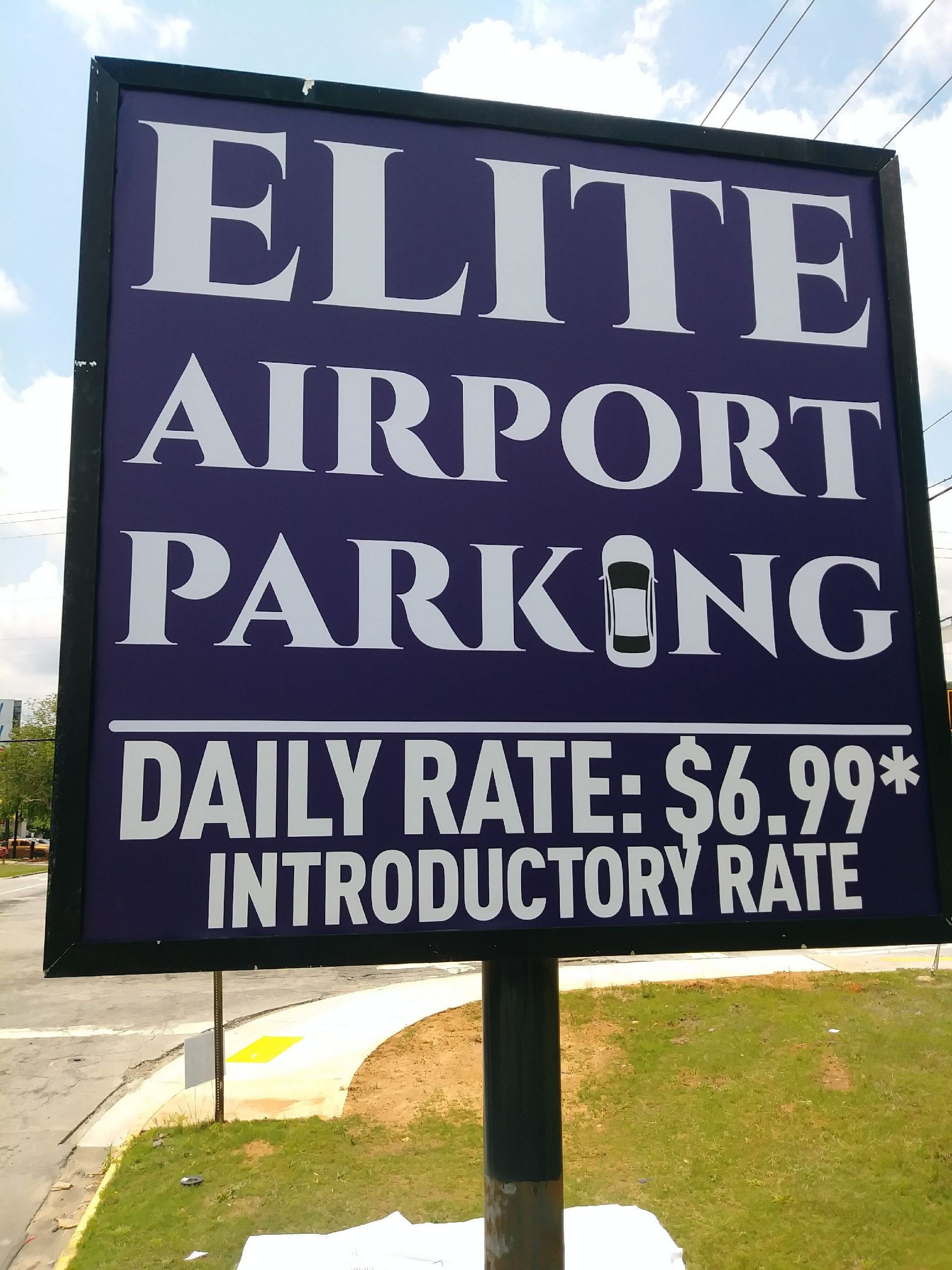 A purple sign that says elite airport parking