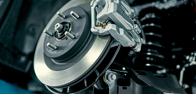 Up close to pair of brakes under vehicle | Seehorn Tire