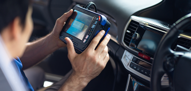 Technician performing inspection on vehicle | Seehorn Tire