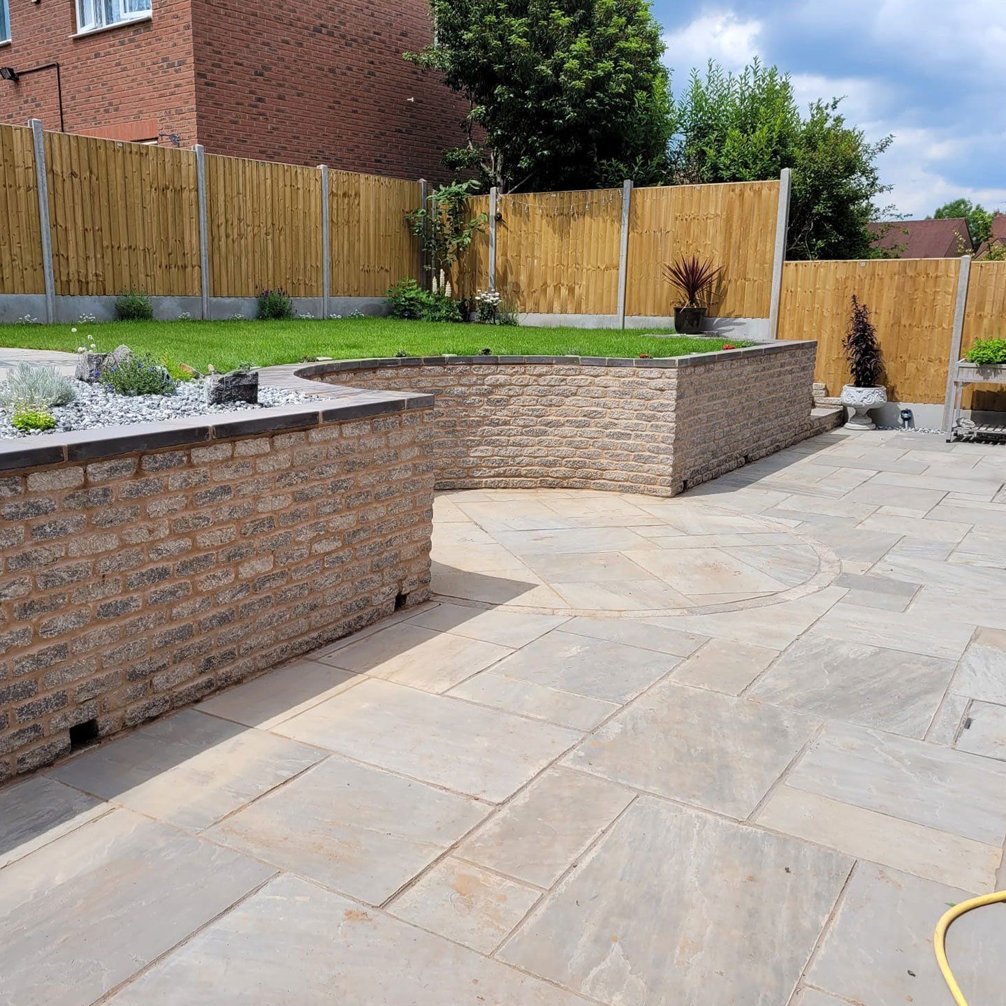 DNA Landscapes Coventry - retaining wall around a patio in Coventry