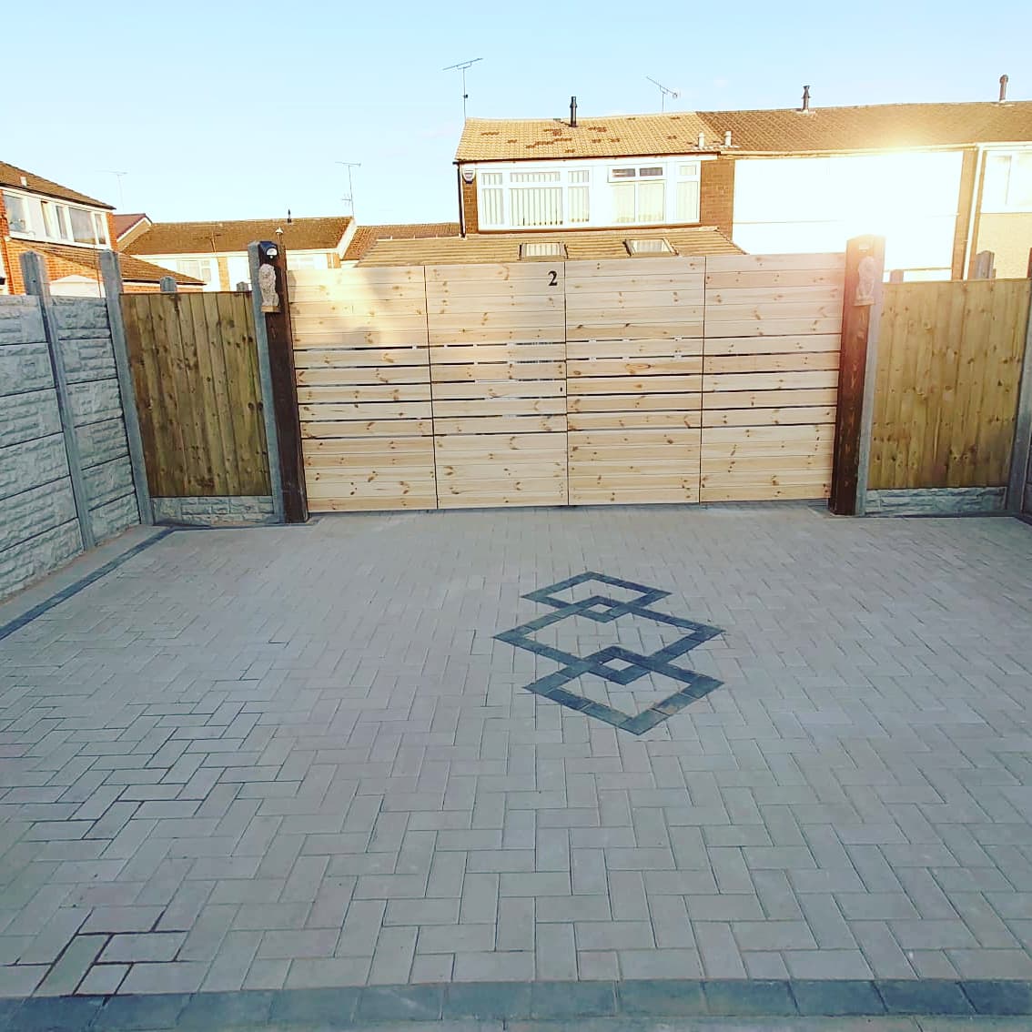 block paving back yard with design in Coventry