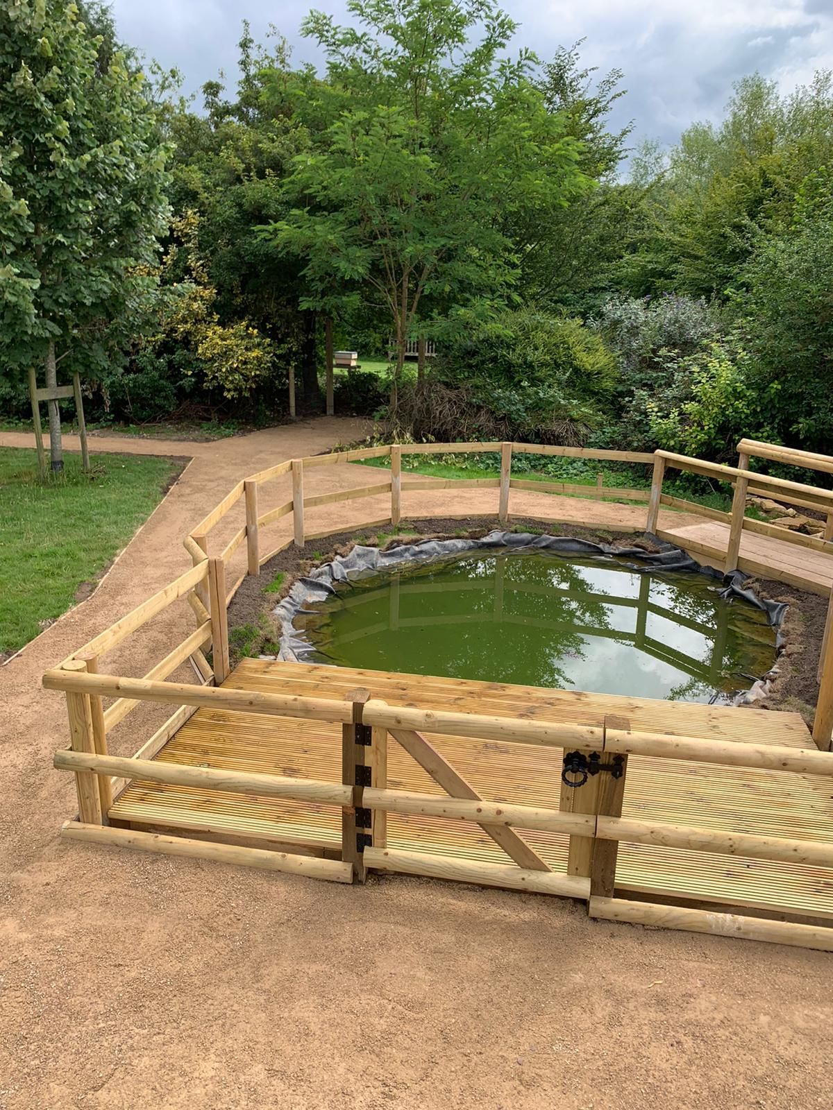 DNA Landscapers Kenilworth finished pond fenced off