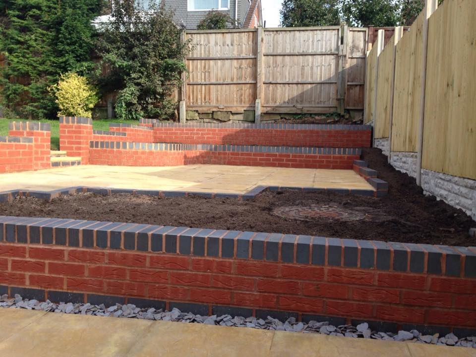 DNA Landscaping Contractors Coventry building retaining wall around a multi-layer patios