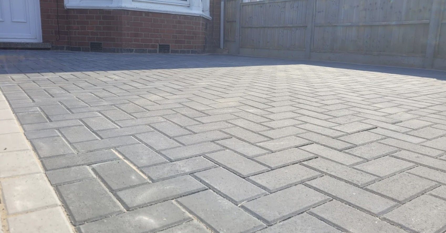 DNA Landscapes close up of a herringbone block paving driveway on Coventry