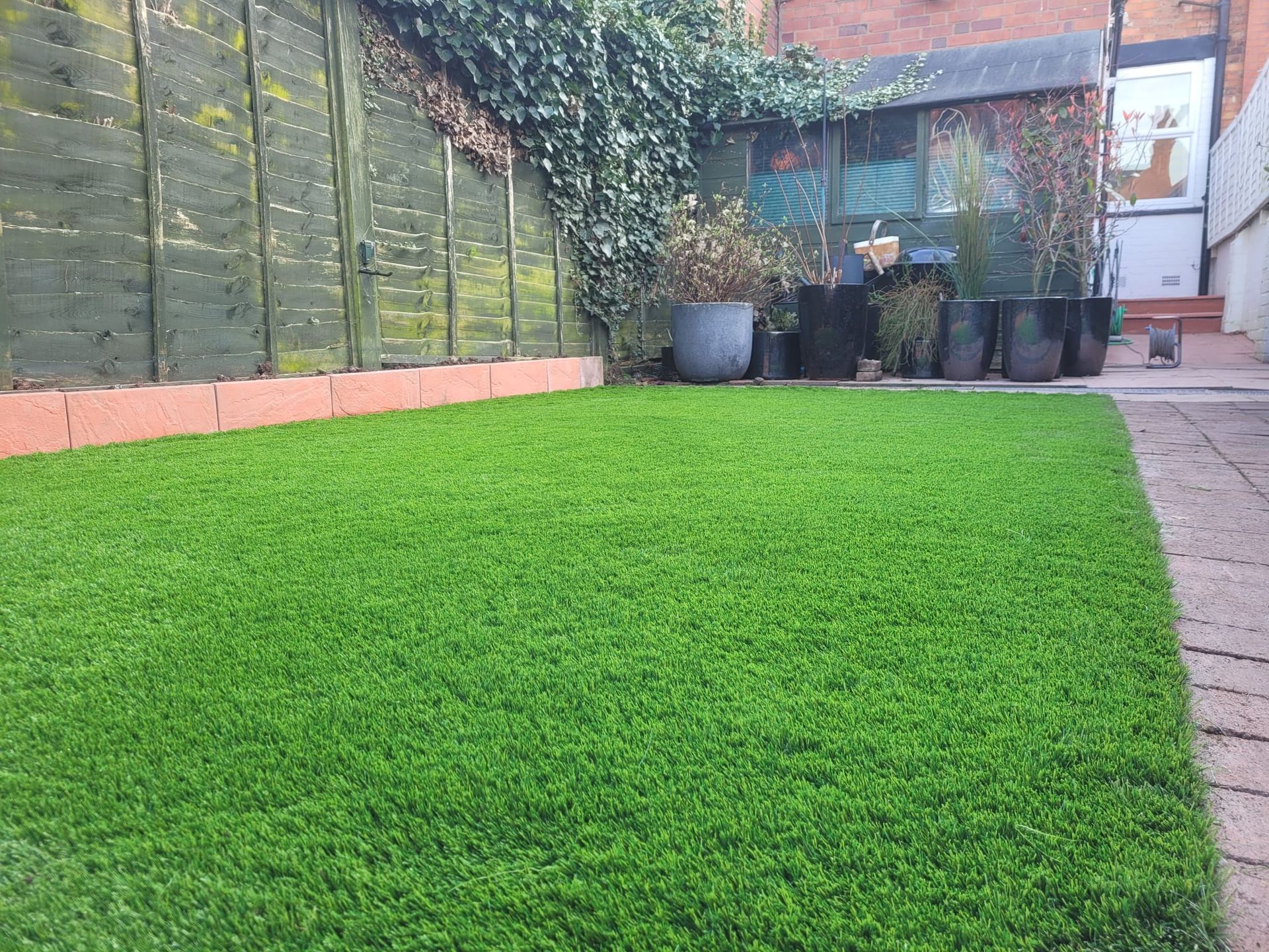 new artificial grass lawn fitted by DNA Landscapes Coventry