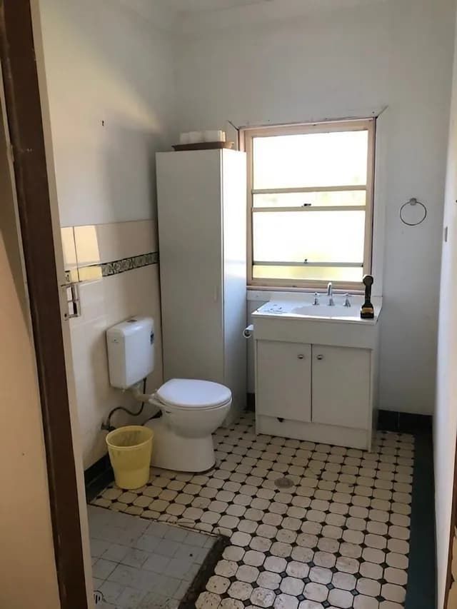 Bathroom With Toilet And Cabinet — Alcando Renovations & Maintenance In Taree, NSW