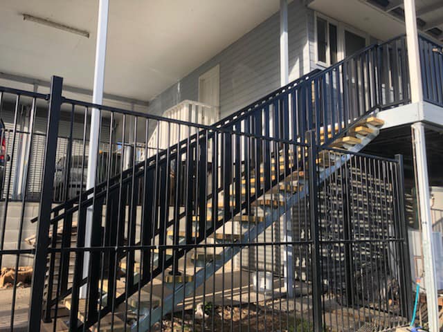 Stairs With Black Handrails — Alcando Renovations & Maintenance In Taree, NSW
