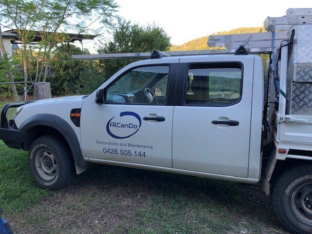 A White Truck with The Word Accordo on The Side Is Parked in The Grass — Alcando Renovations & Maintenance In Taree, NSW